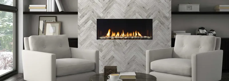 Gas fireplace with clean flames behind glass